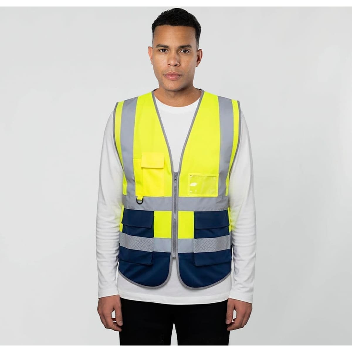 A safety wear vest in bright yellow with reflective strips and navy blue pockets, featuring a logo on the front.