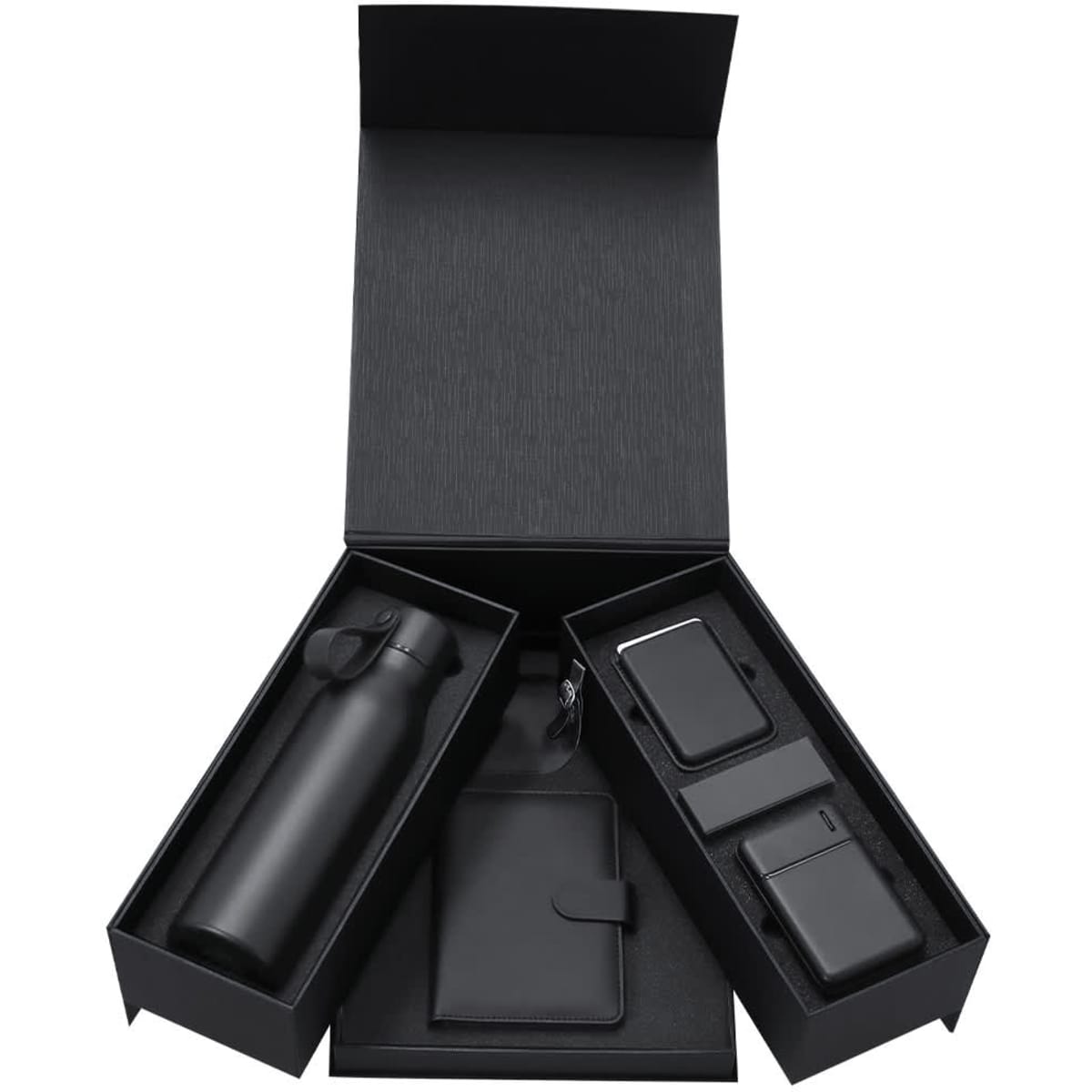 A black gift box containing a drink bottle, a wallet, and two tech accessories, all in black.