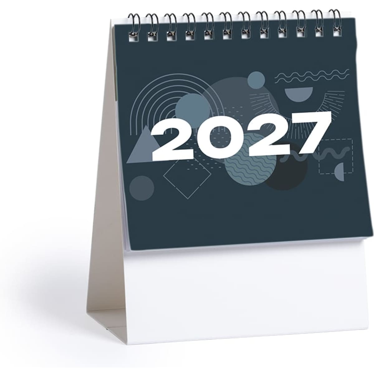A desk calendar for 2027, featuring a dark blue cover with abstract shapes and a white spiral binding.