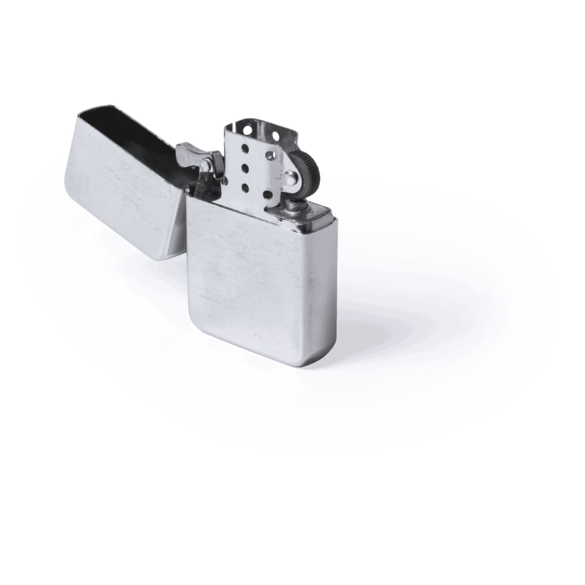 A silver lighter with a flip-top design, featuring a textured surface and a circular ignition mechanism.