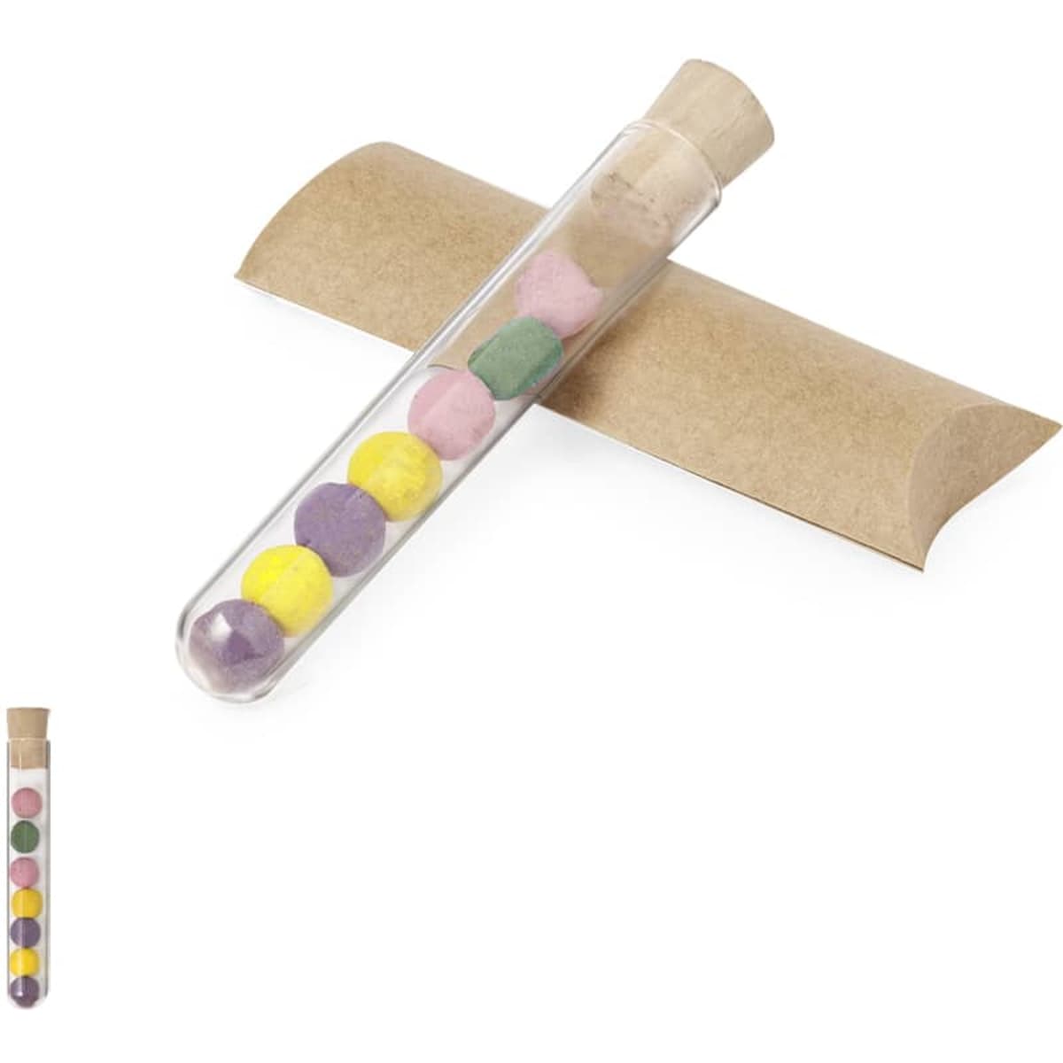 A test tube filled with colourful chocolate balls resting on a brown paper tube, featuring a cork stopper.