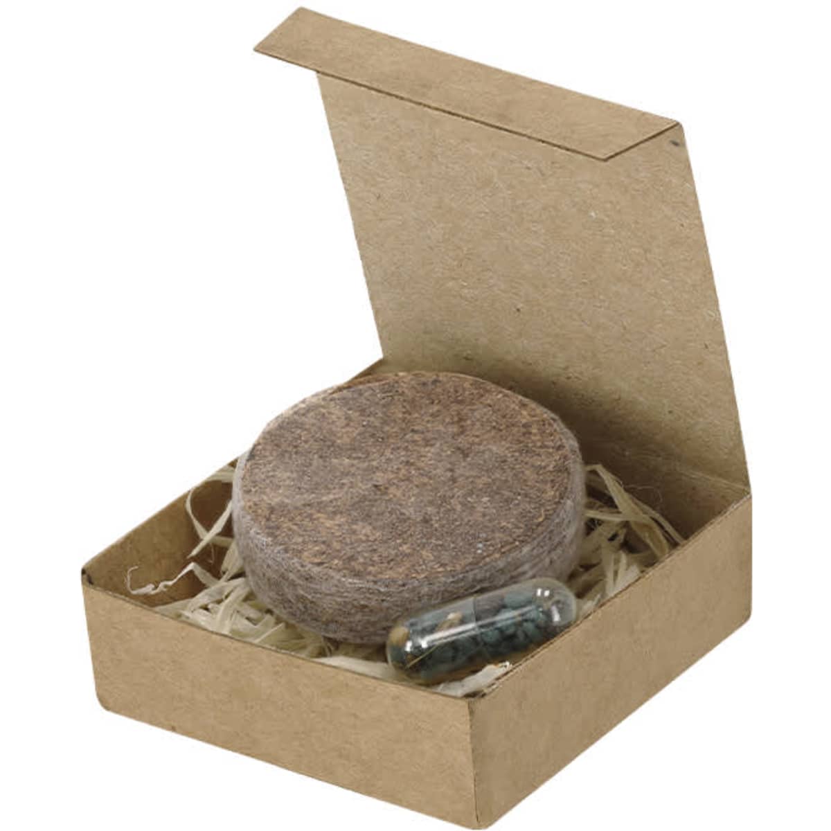 A round seed disc in a natural-coloured box with packing material, accompanied by a small capsule.
