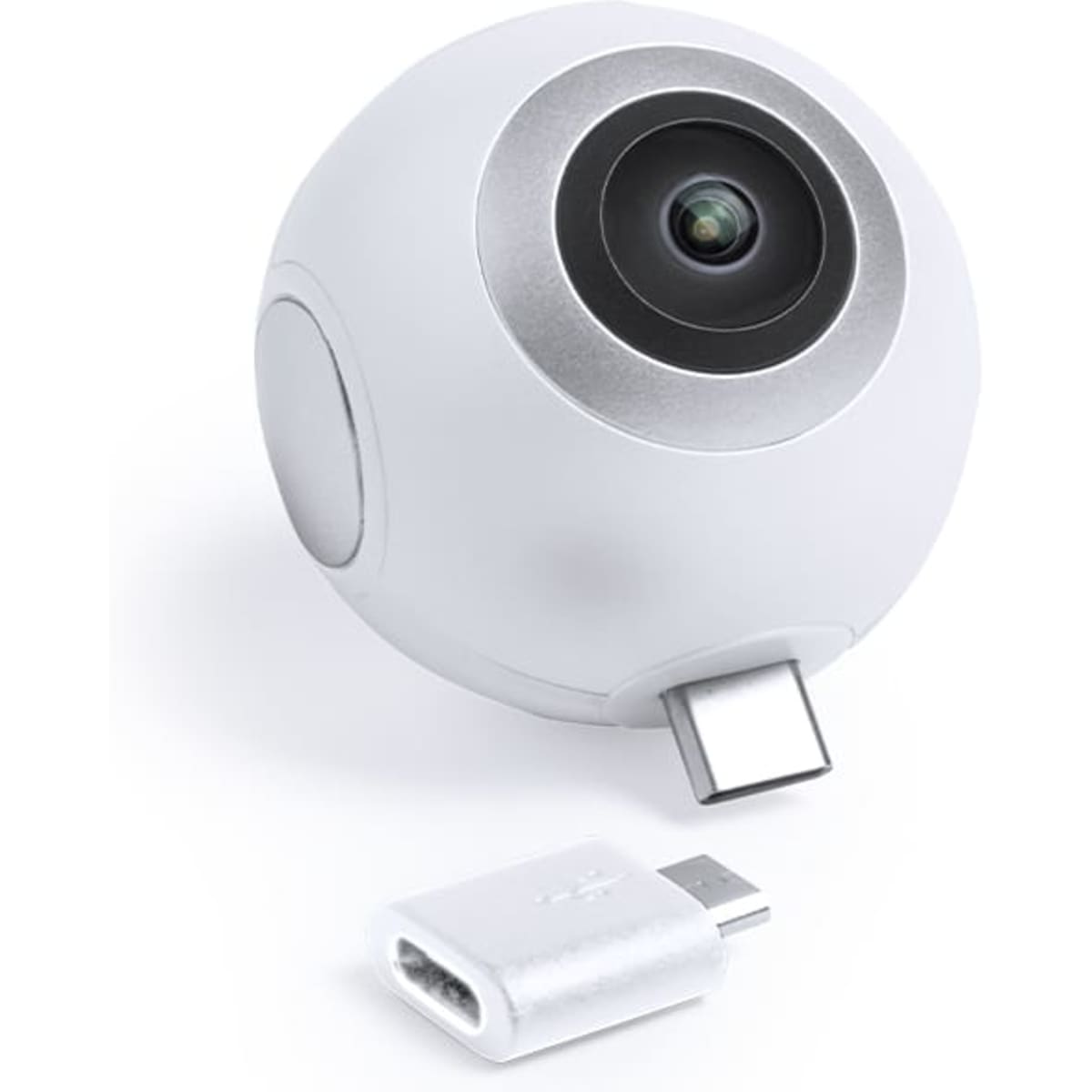 A compact white camera with a rounded design, featuring a lens and USB connector, accompanied by a USB adapter.