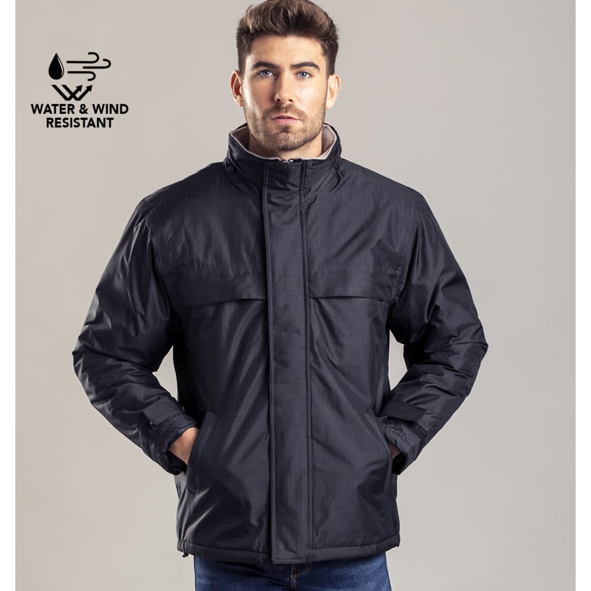 A dark blue rain jacket with a collar and pockets, featuring a logo indicating water and wind resistance.