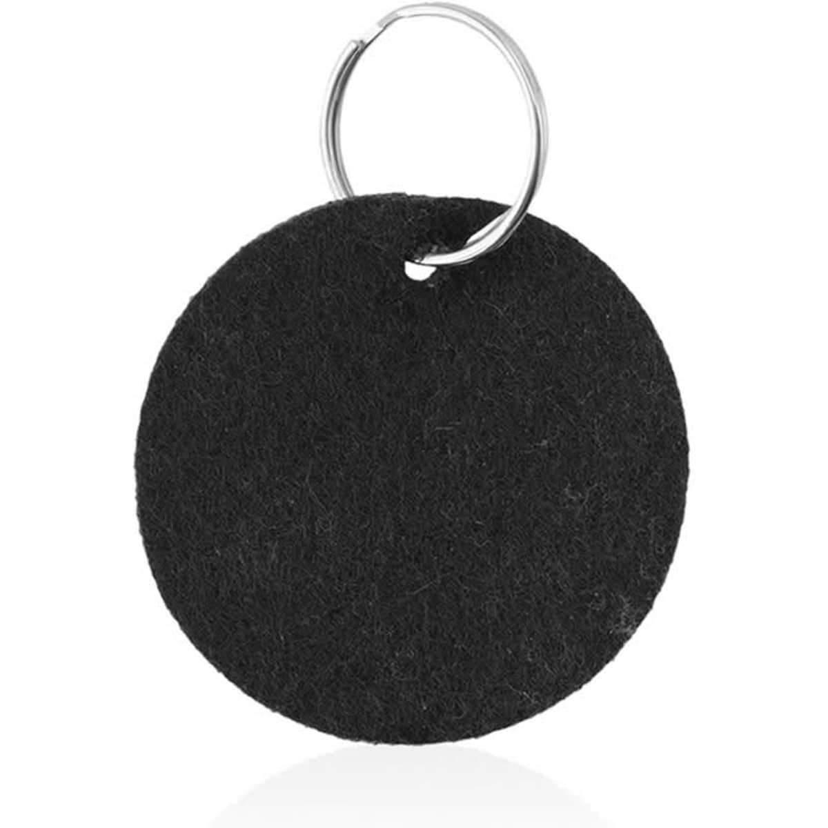 A round black felt keyring attached to a metal hoop. It has a simple and clean design.