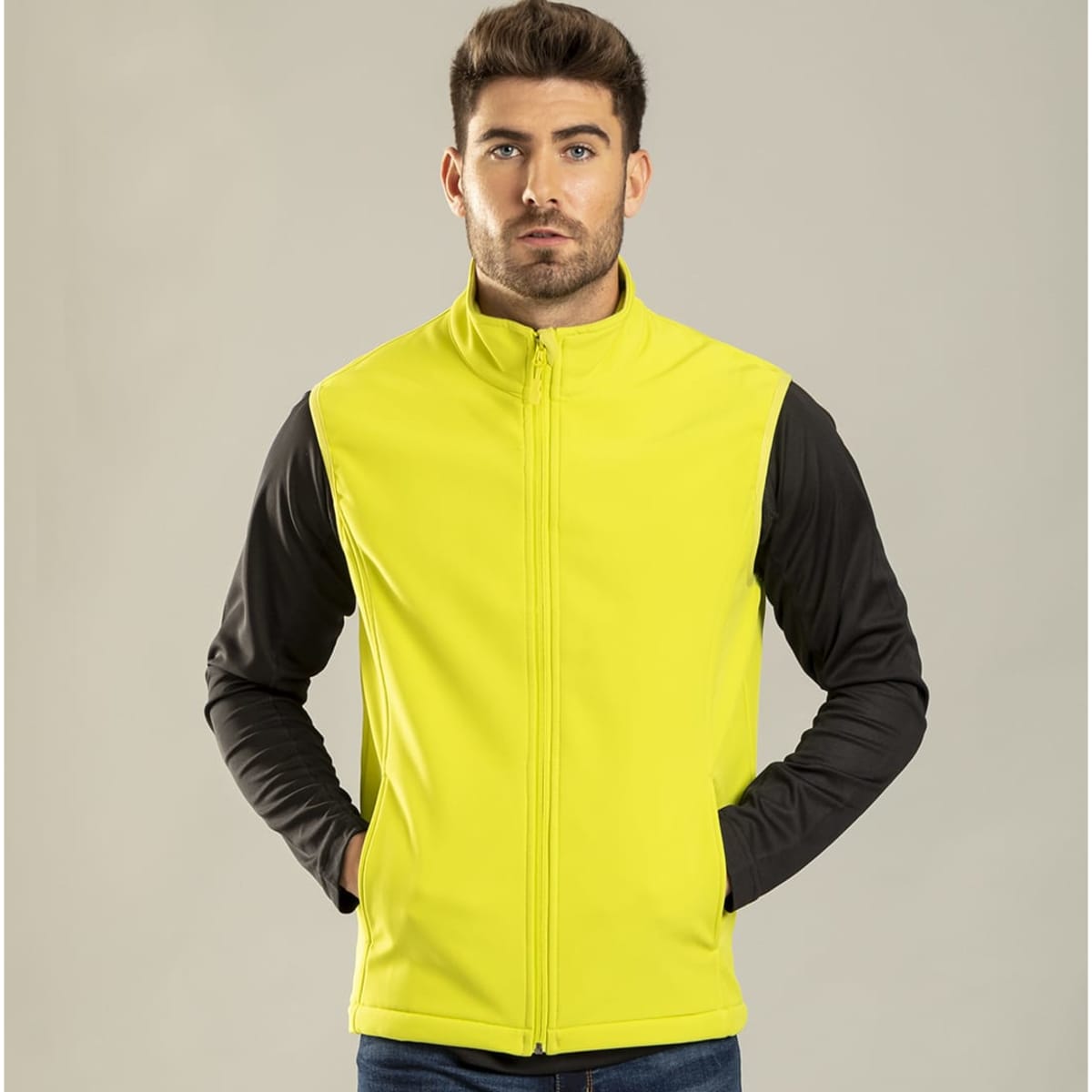 A vibrant high-visibility yellow vest jacket with black sleeves and a front zipper, featuring pockets and a logo.