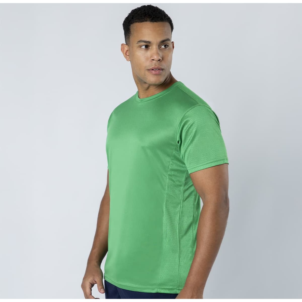 A green T-shirt with short sleeves, featuring a logo on the front, displayed against a light background.
