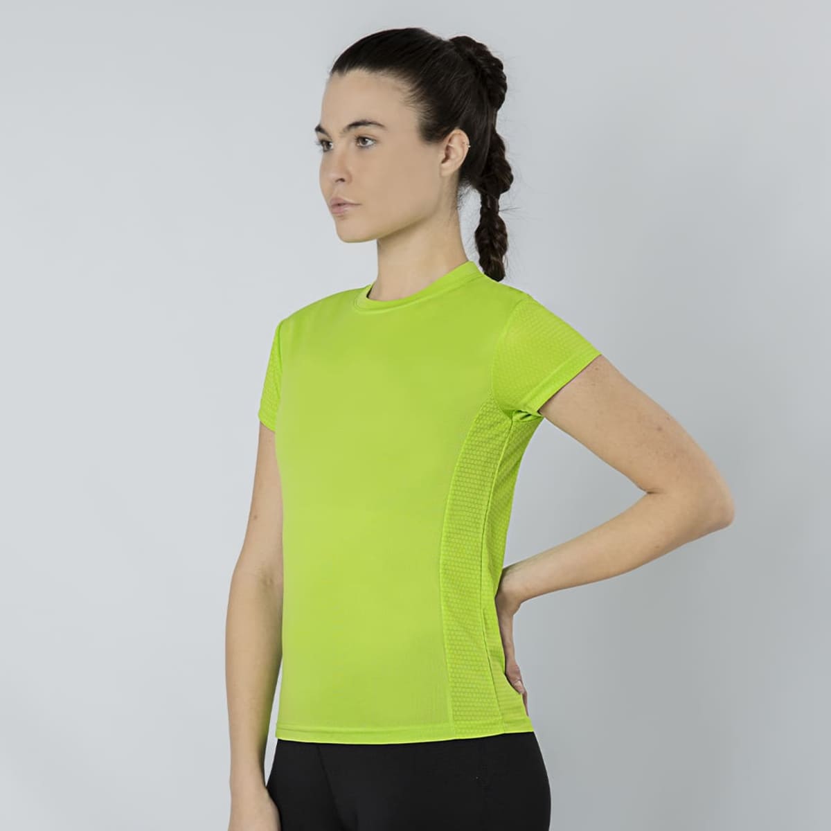 A bright green T-shirt with a fitted design, featuring short sleeves and a textured side panel.