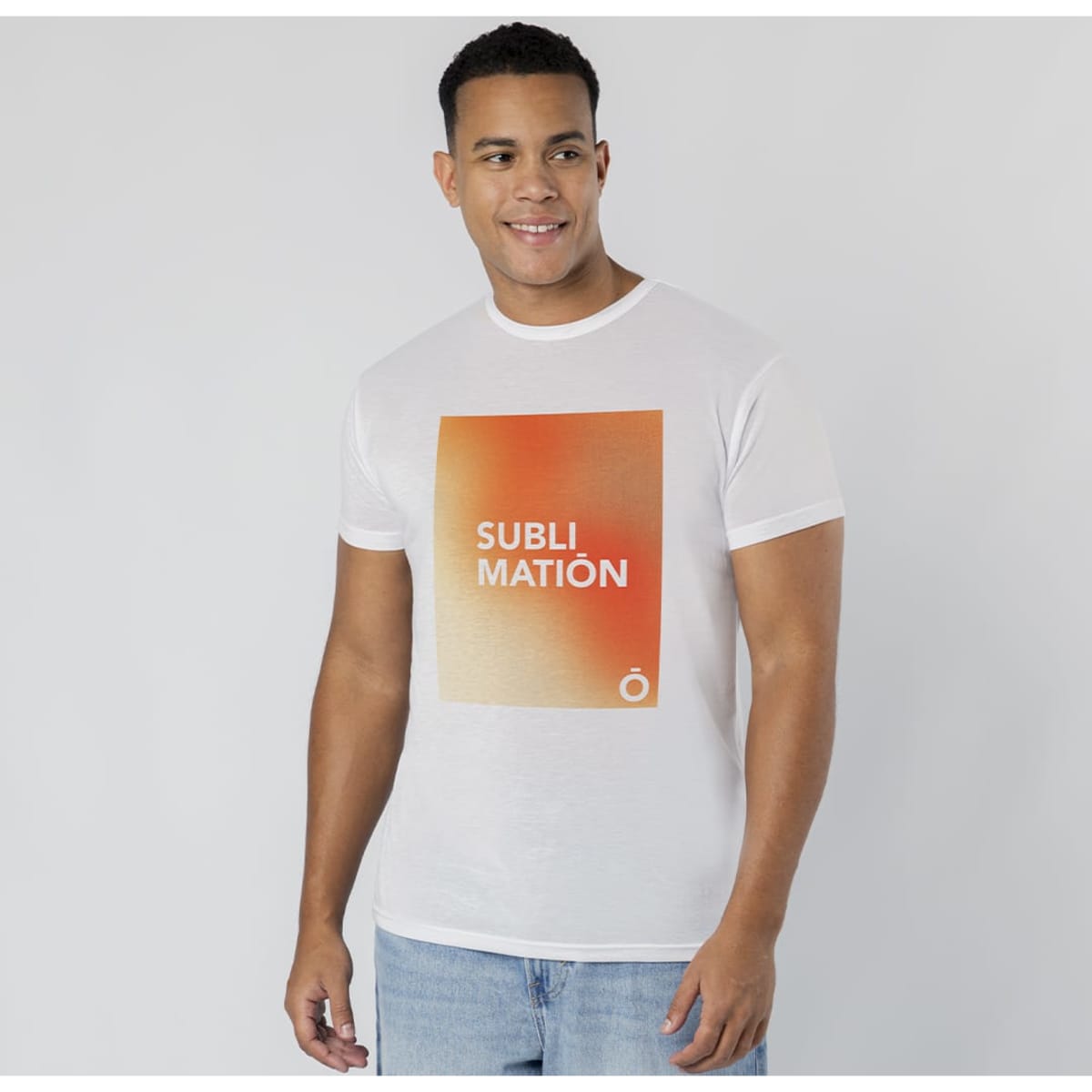 A white t-shirt featuring an orange gradient square design and a logo, worn by a smiling male model.