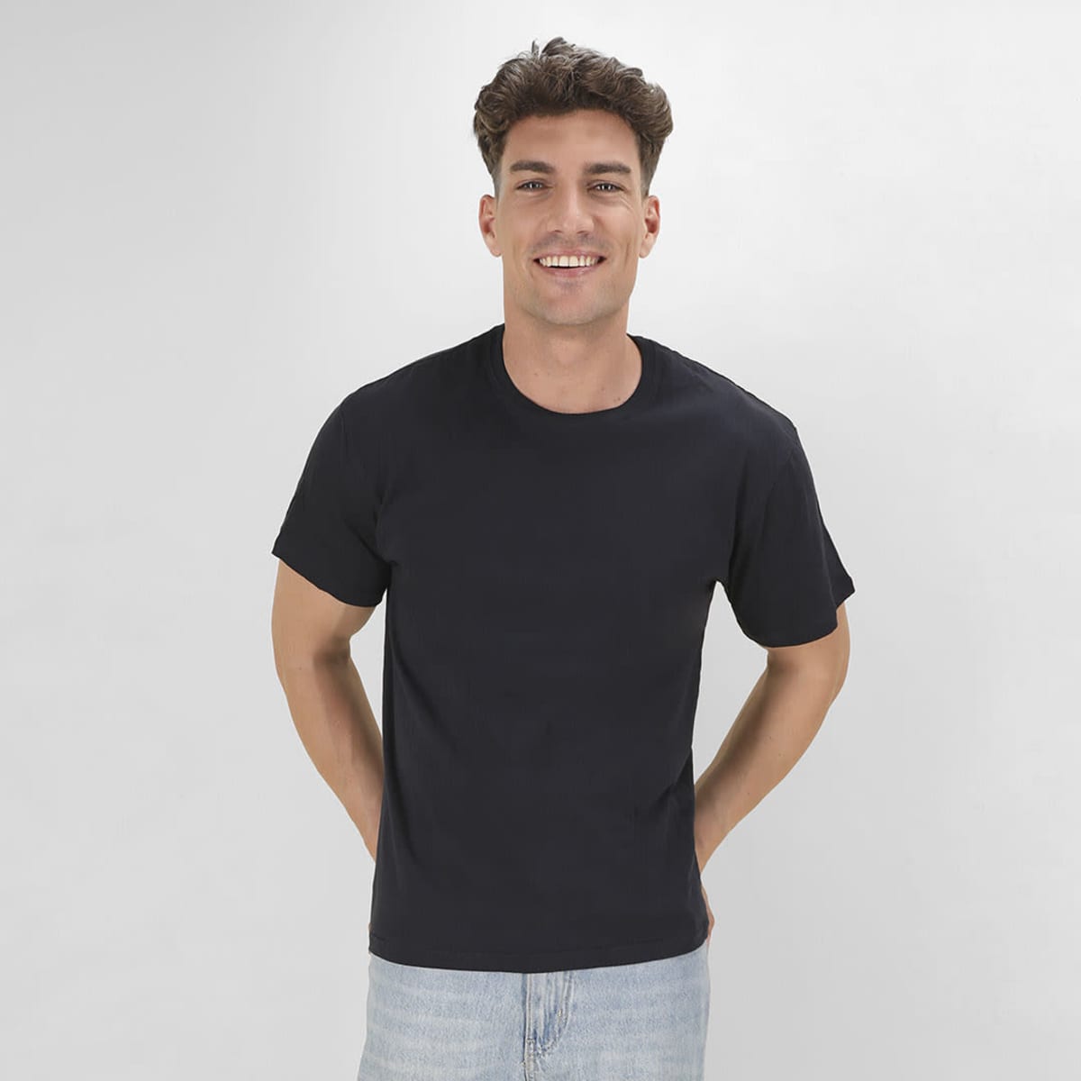 A black MC130 T-shirt displayed on a model, featuring a simple design and a logo.