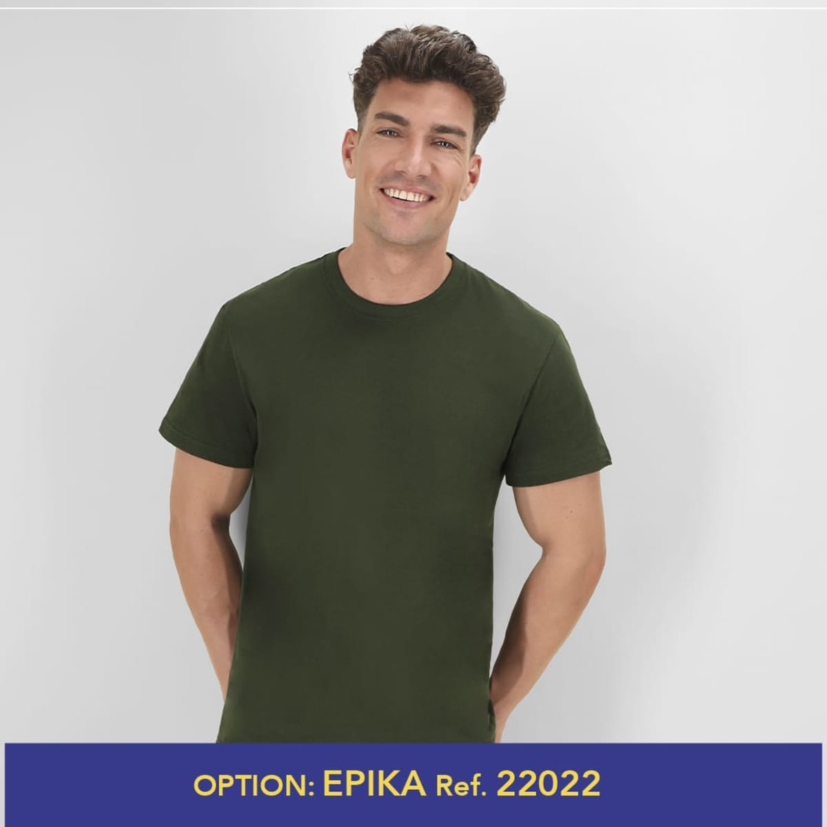 A green MC150 T-shirt displayed on a smiling male model, featuring a logo on the shirt.