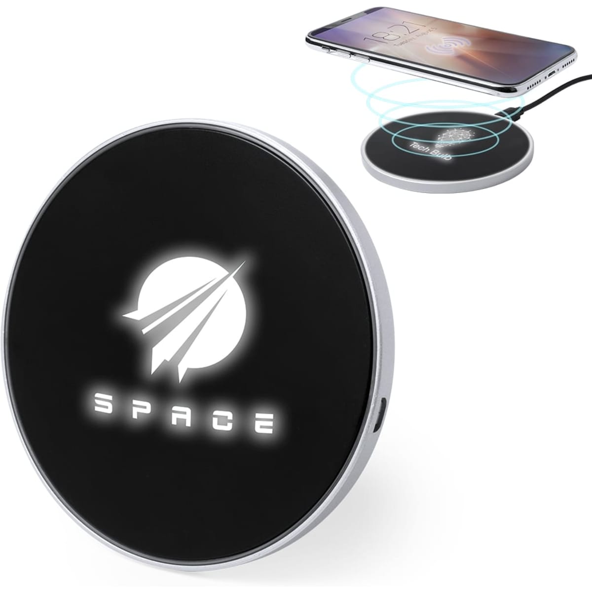 A circular black wireless charger with a silver border and a logo, placed beside a charging smartphone.
