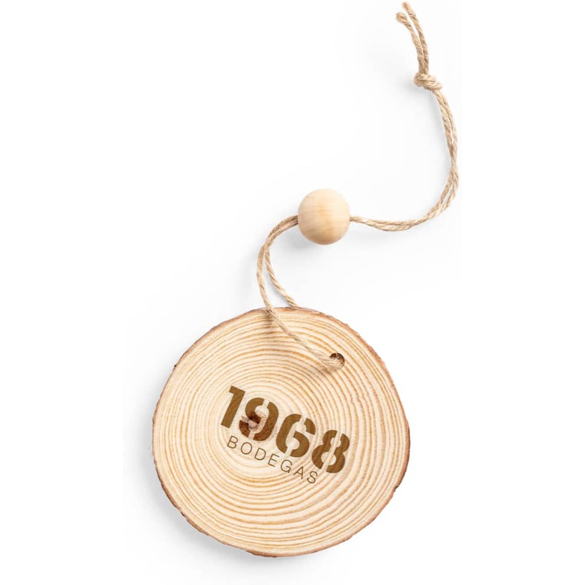 A wooden ornament shaped like a slice of tree trunk, featuring a number “1968” and a twine loop for hanging.
