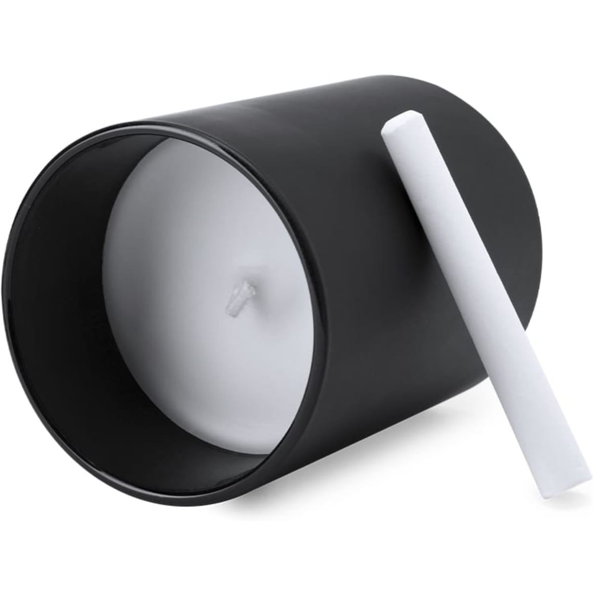 A black cylindrical candle with a white wax interior, accompanied by a white candle holder.