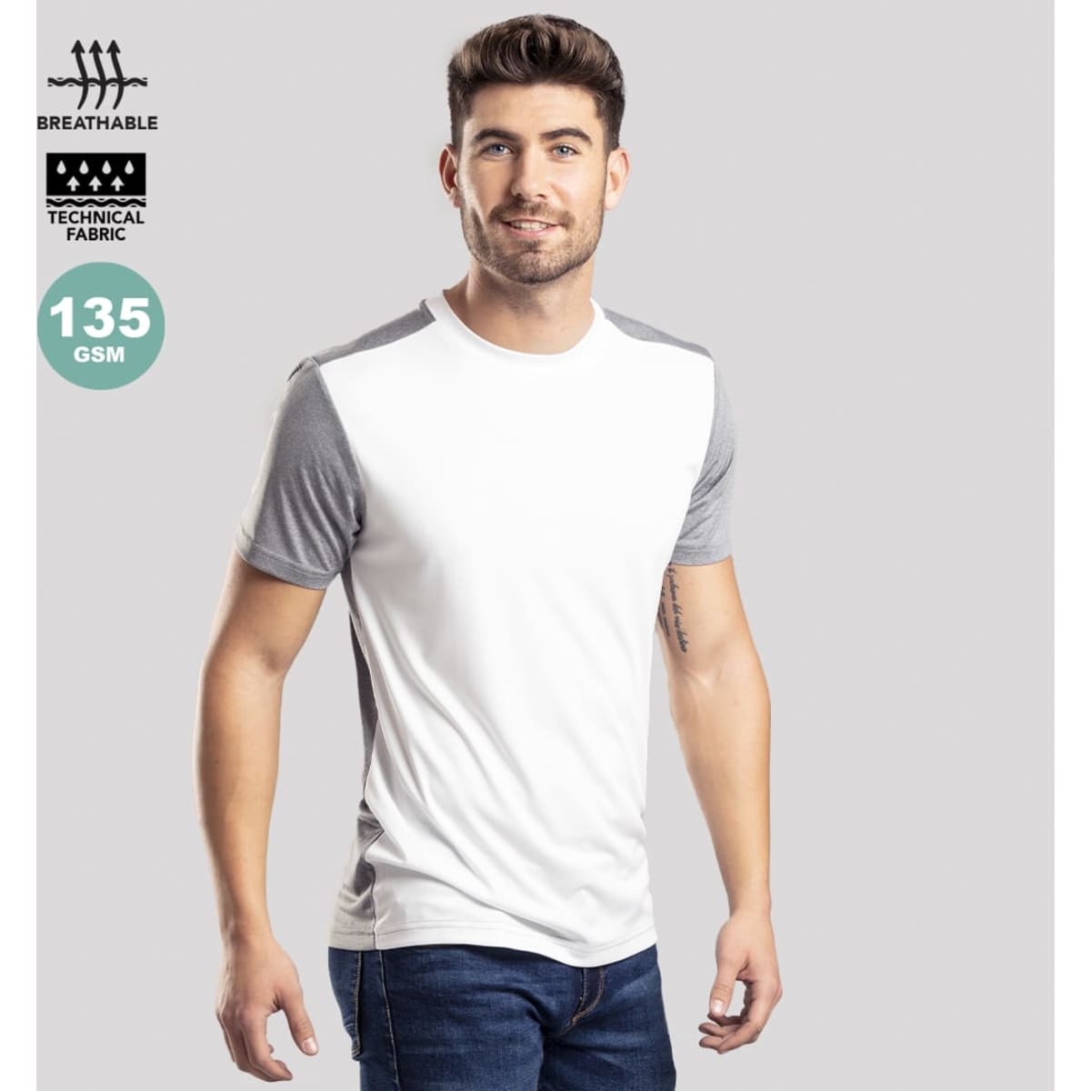 A model wearing a white and grey adult T-shirt made from breathable technical fabric. The shirt features short sleeves.