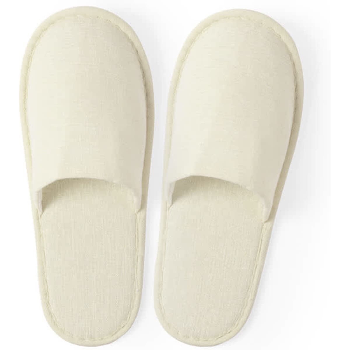 A pair of cream-coloured Nalton slippers with an open toe design, featuring a simple and comfortable style.