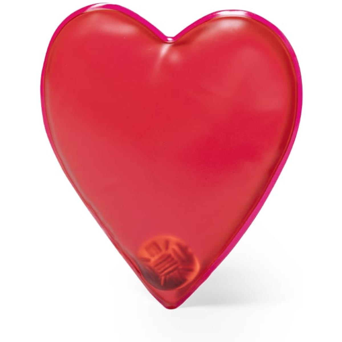 A red heart-shaped product with a glossy finish and a small rounded base. It features a logo on the surface.