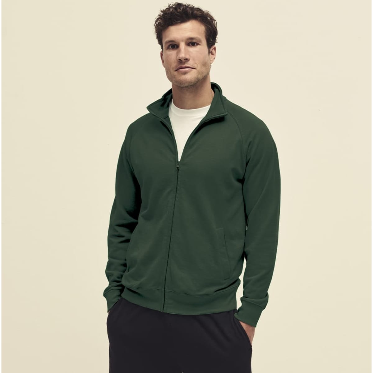 A lightweight sweat hoodie in dark green, featuring a zip front and a logo. The model is wearing it with black pants.