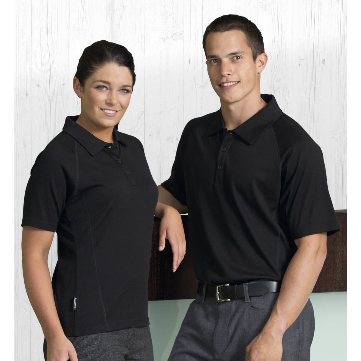 A black short sleeve polo shirt for men, featuring a logo, displayed on a male and female model.
