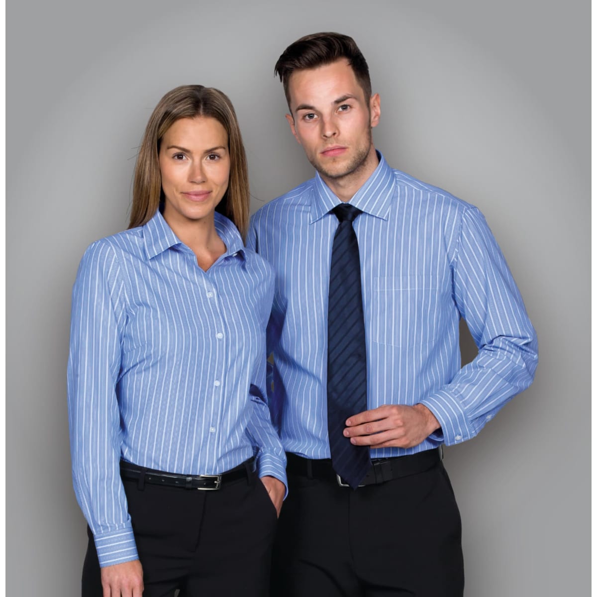 A blue striped button-up shirt featuring a classic collar, worn by a woman and a man. The shirt has a logo.