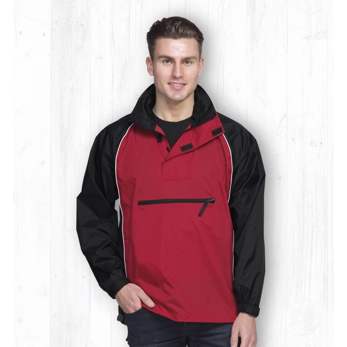 A red and black nylon jacket with a zippered pocket and a stand-up collar, featuring a logo.