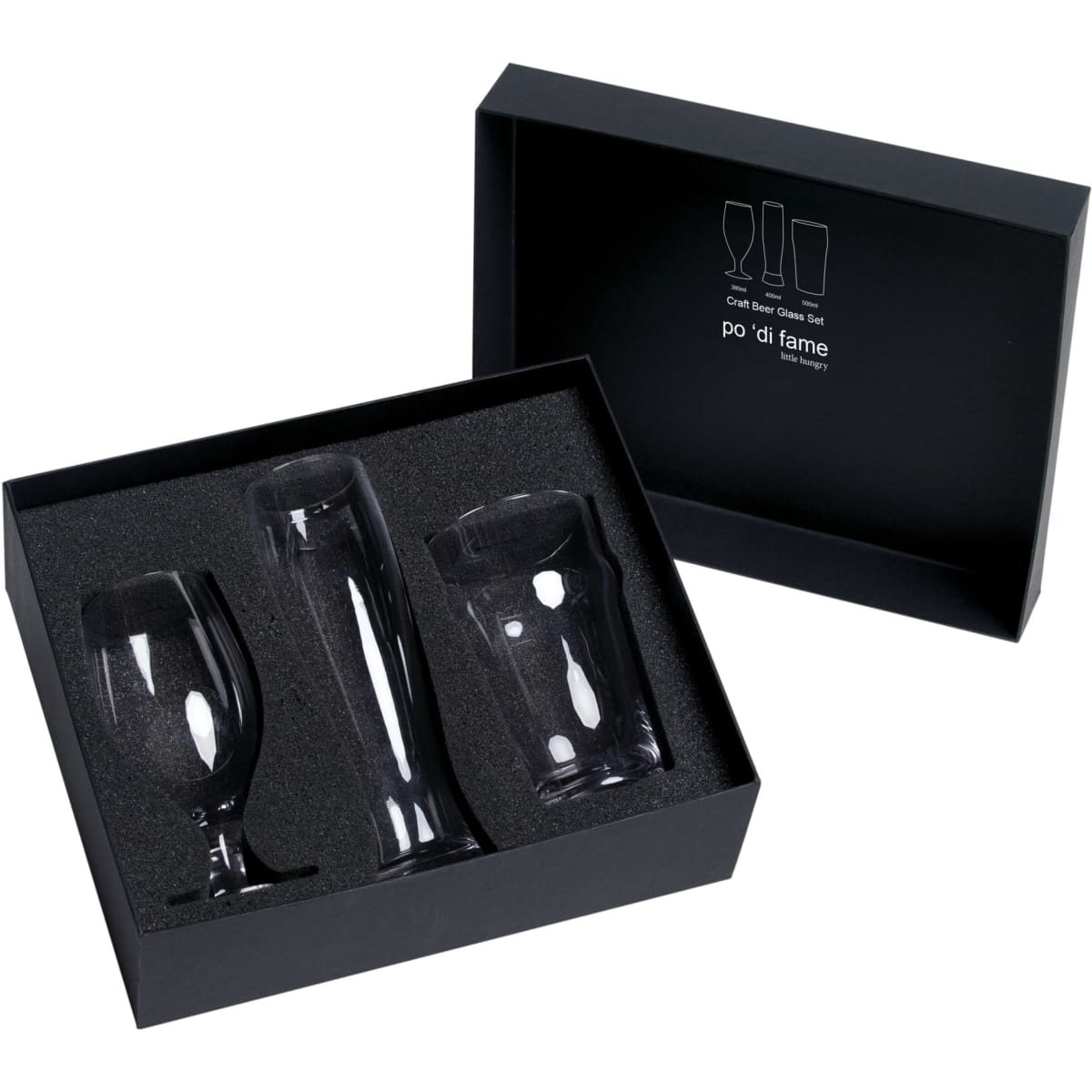 A black box containing three craft beer glasses in various shapes, resting on a soft black insert.