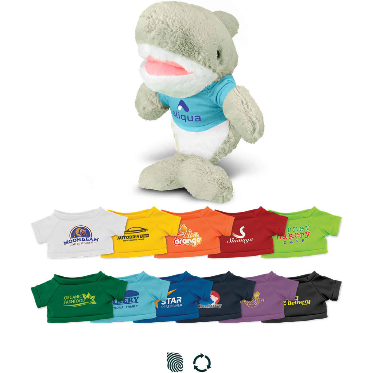 A plush shark toy in grey and white, wearing a blue top, surrounded by various mini t-shirts in different colours.