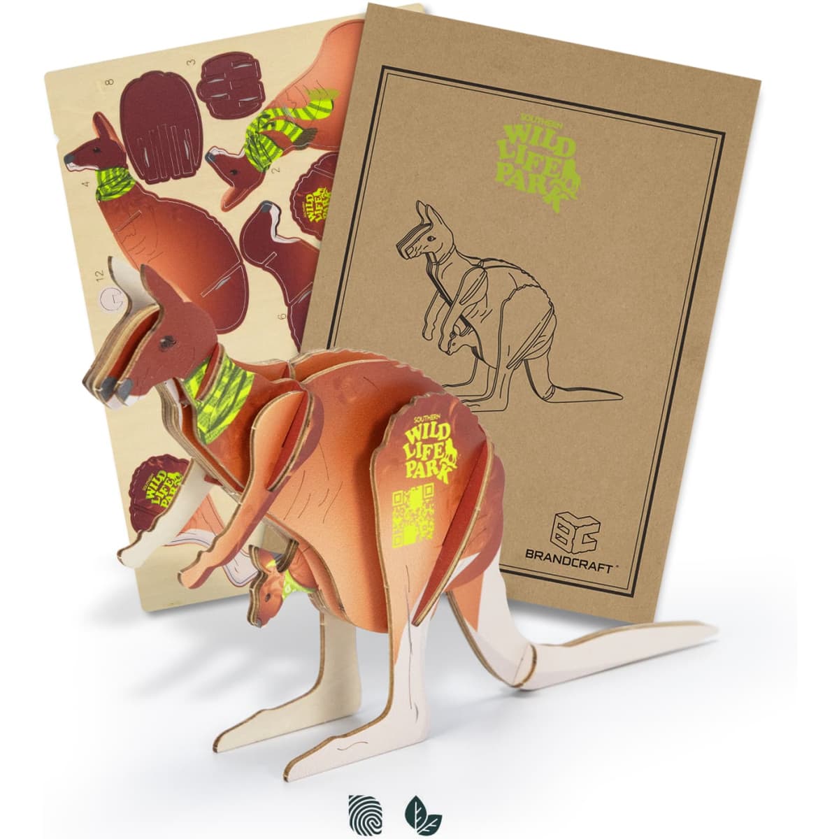 A wooden kangaroo model in brown, featuring various pieces and a design template, presented in a cardboard package with a logo.
