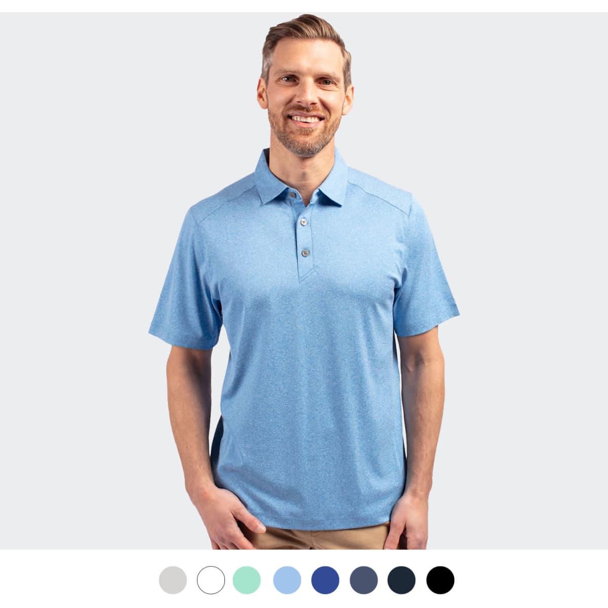 A light blue men's polo shirt with a collar and a logo, displayed on a smiling model.