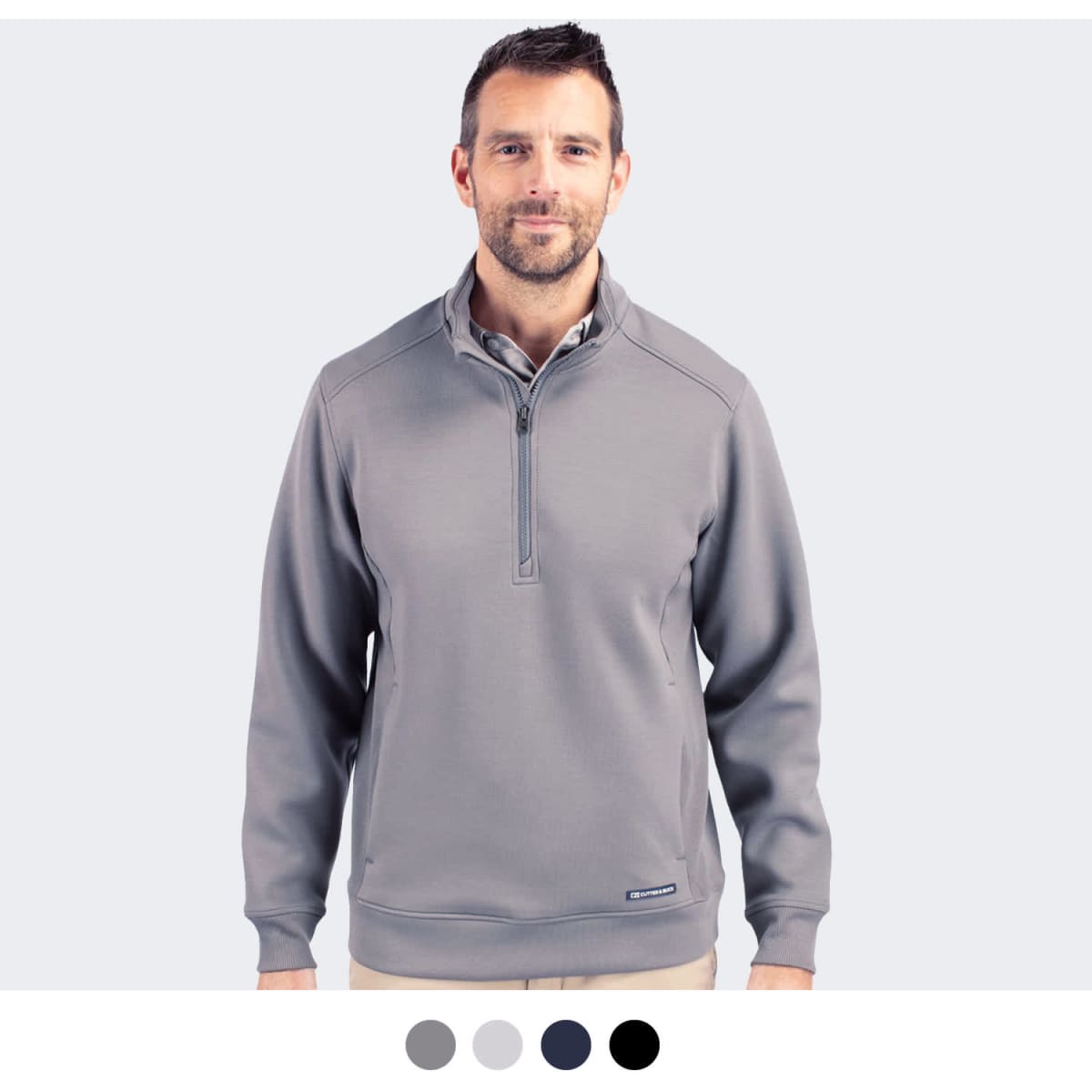 A half zip jacket in grey with a collar and long sleeves, featuring a logo on the chest.
