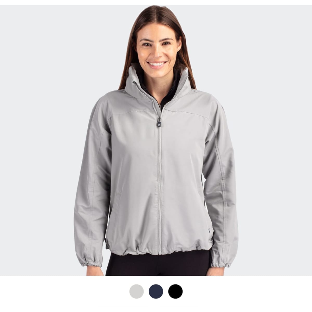 A light grey women's full zip jacket with a zip-up collar and elasticised hem, featuring a logo.