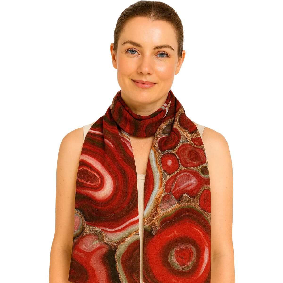 A woman wearing a red and brown patterned silk scarf, featuring swirling designs reminiscent of agate. The scarf has a logo.