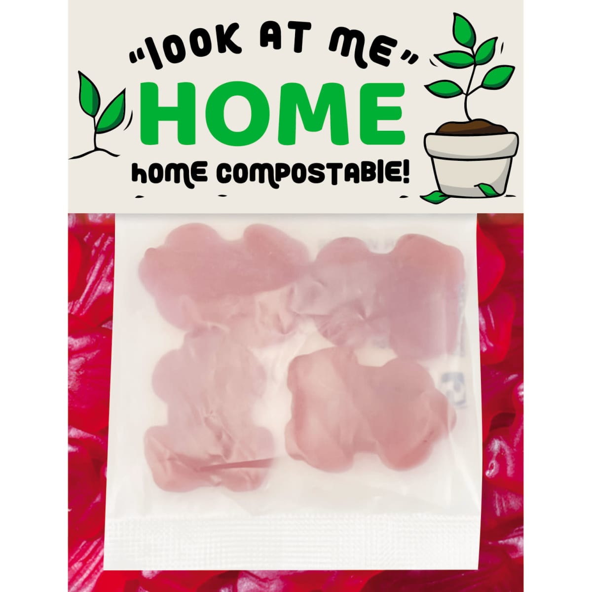 A pack of pink gummi lollies shaped like frogs, featuring a logo and compostable packaging.