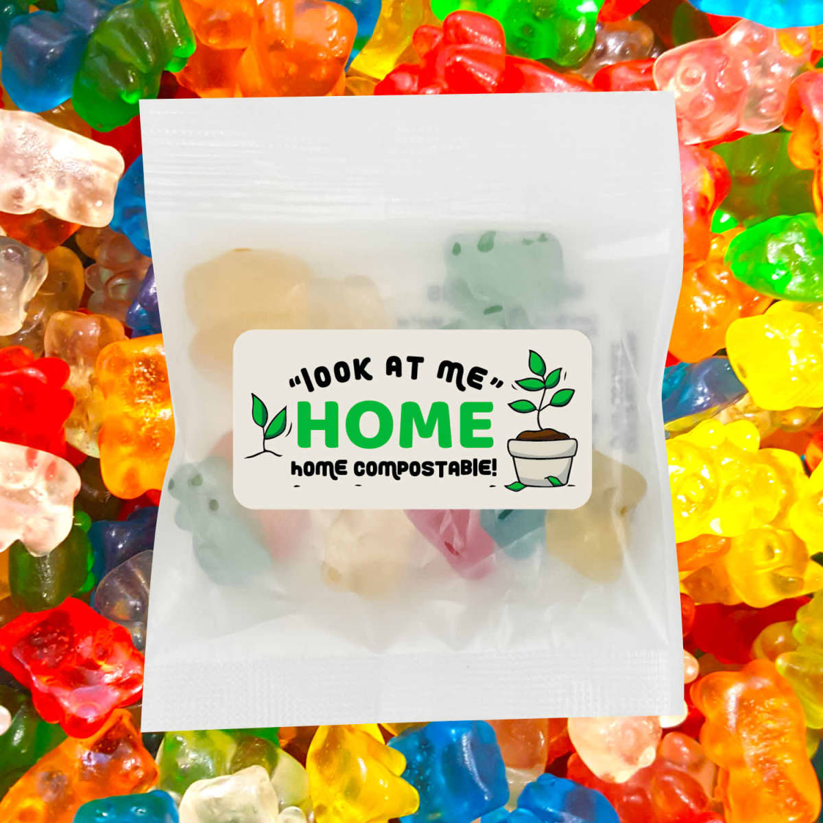 A packet of ECO Gummy Bears surrounded by colourful gummy sweets, featuring a cute logo and compostable message.