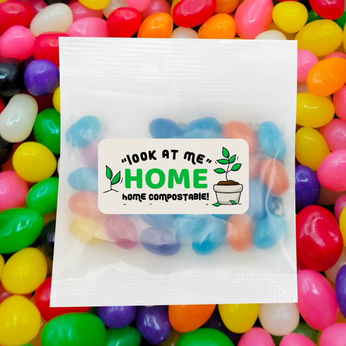 A packet of mixed jelly beans in various vibrant colours, surrounded by a multitude of jelly beans. Features a branding label.