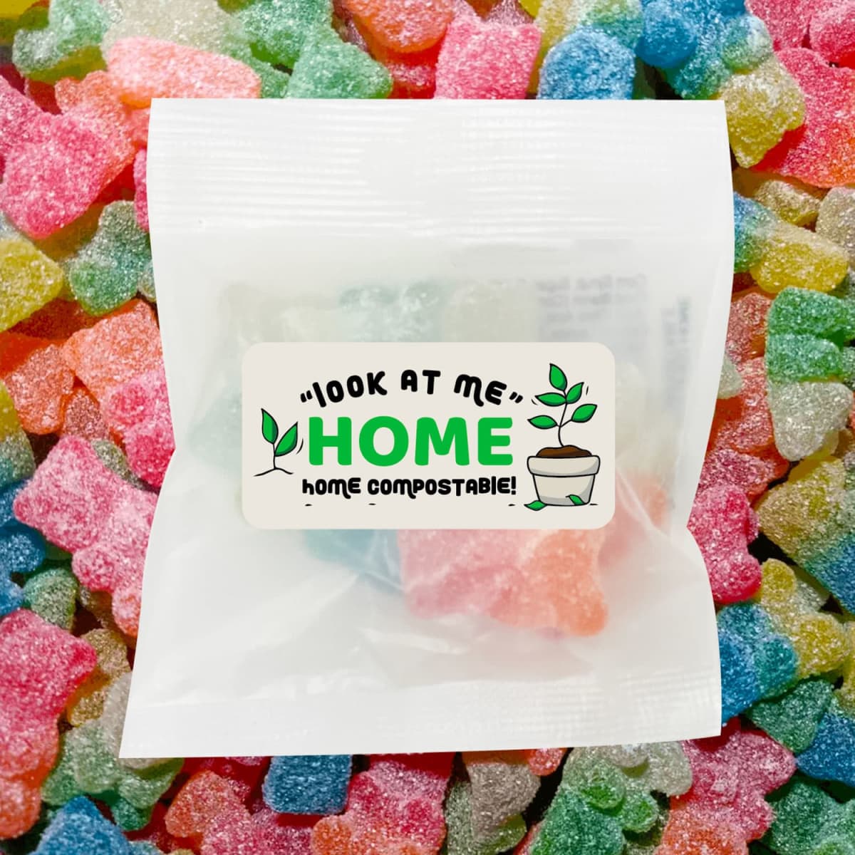 A clear bag containing colourful gummy bears in assorted bright colours, surrounded by more gummy candies.