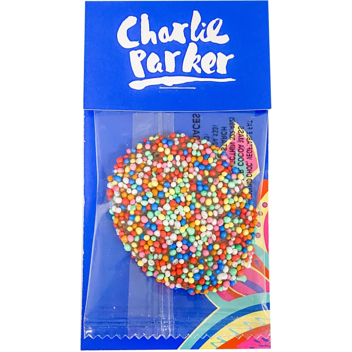 A chocolate freckle covered in colourful sprinkles, packaged in a blue cardboard sleeve with a logo.