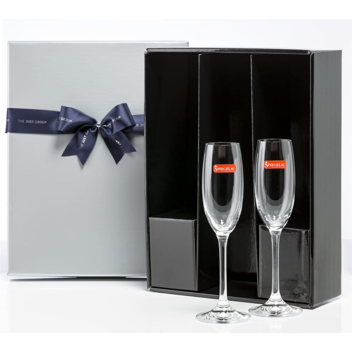 A gift box containing two elegant champagne flutes with a sleek black interior and a decorative ribbon.