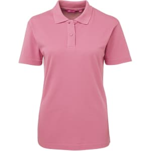 A pink polo shirt for women featuring a collar and buttoned placket, with a logo on the chest.