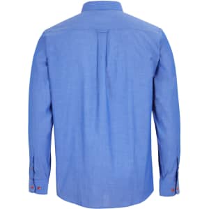 A long-sleeve indigo chambray shirt featuring a back pleat and buttoned cuffs. The shirt has a logo.