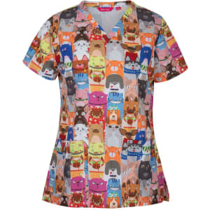 A multicoloured scrub top featuring playful animal faces in various designs and a logo on the label.