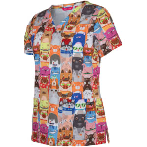 A colourful scrub top featuring a playful animal print in orange, blue, and red tones. It has a logo on it.