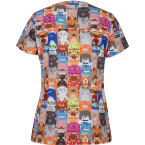 A colourful women's scrub top featuring a whimsical print of various animal faces. The design has multiple vibrant hues.