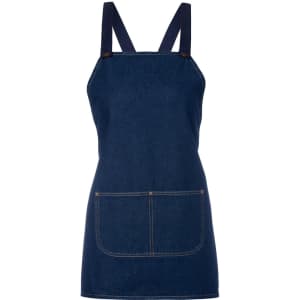 A navy denim bib apron featuring crossback straps and a front pocket. Includes branding on the design.