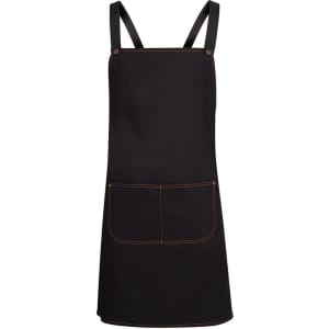 A black cross-back canvas apron featuring an orange stitched pocket. It has straps without additional fastening.