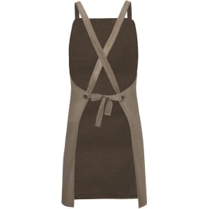 A cross back canvas apron in olive green with a contrasting beige trim and tied waist. Features a logo.