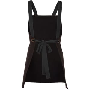 A black bib canvas apron with a cross back design and a tied waist, featuring a logo.