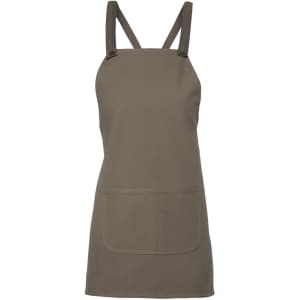 A khaki green canvas bib apron featuring cross back straps and a front pocket. It has a brand logo.
