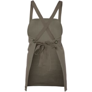 A khaki canvas bib apron with crossback straps and a tied waist, featuring a logo.