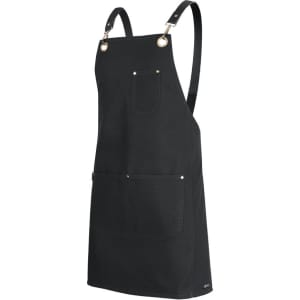 A black canvas apron with brass eyelets, adjustable PU straps, and a front pocket.